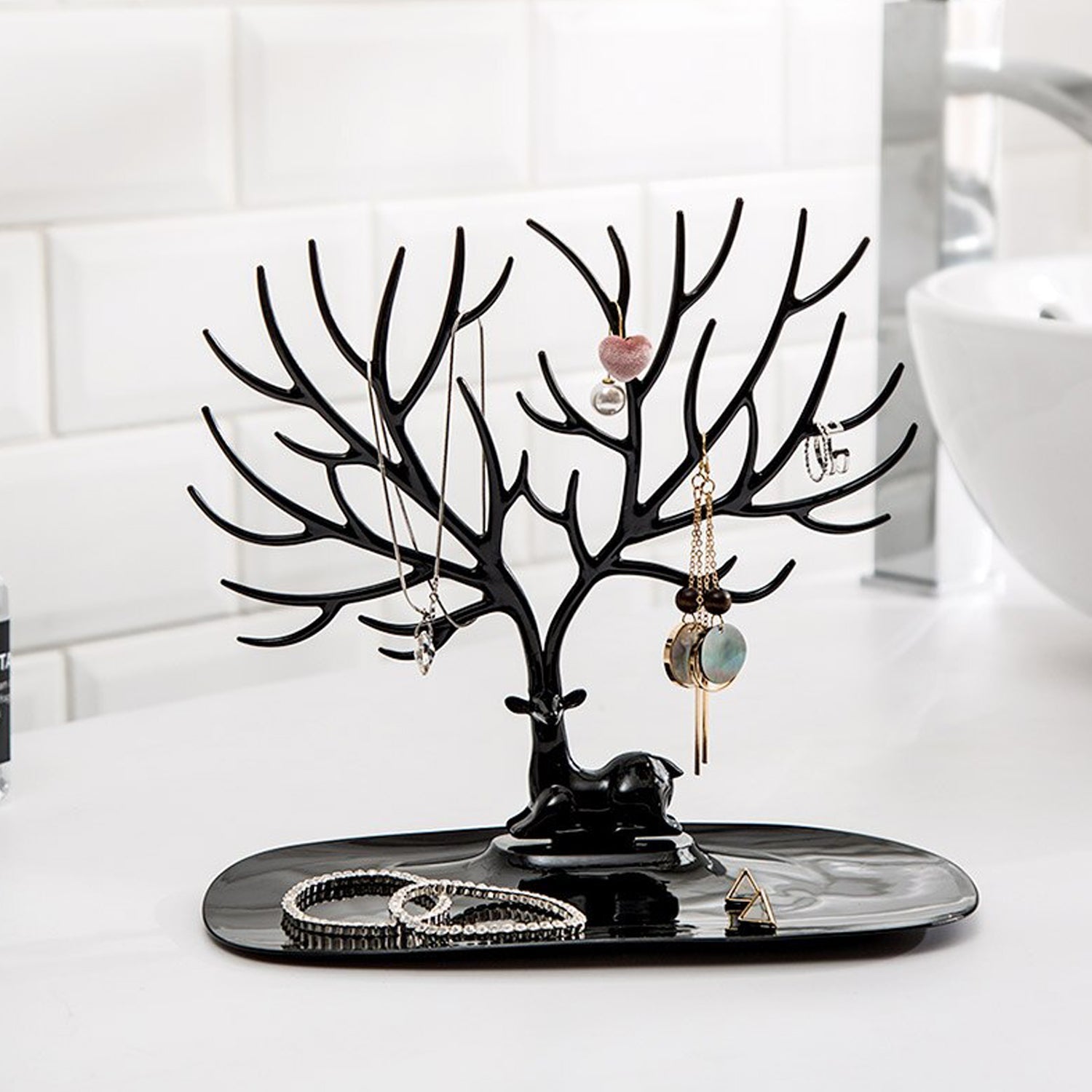 Deer-shaped jewellery holder side view India