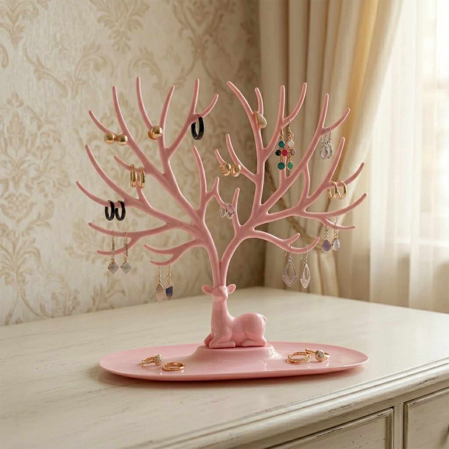 Pink deer antler stand with earrings India