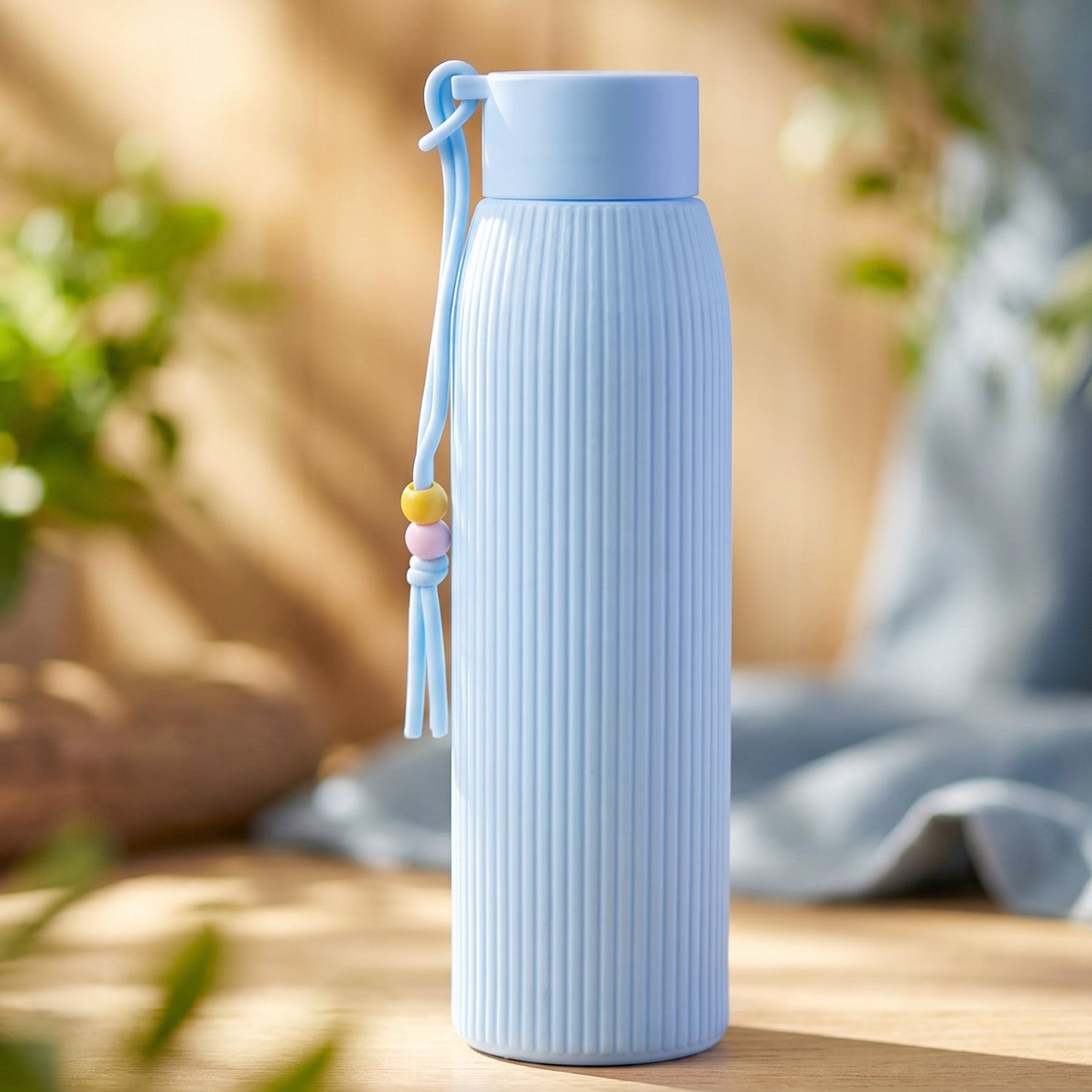stylish blue glass drinking bottle